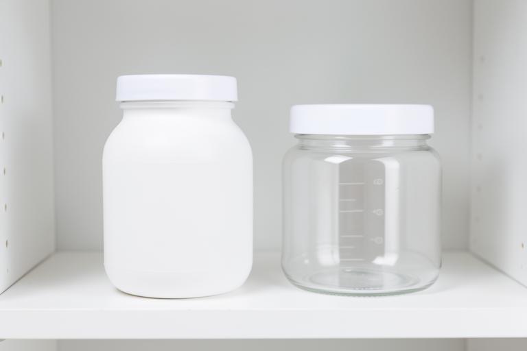 Baby care bottles and jars neatly arranged on a white shelf